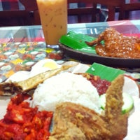 Photo taken at Hot &amp;amp; Spicy Nasi Lemak Family Restaurant by aldy h. on 9/26/2014