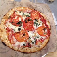 Photo taken at Pieology Pizzeria by Ross M. on 3/12/2015