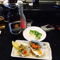 Photo taken at Sun Sushi Bar &amp;amp; Japanese Cuisine by John C. on 1/29/2015