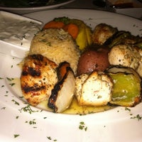 Photo taken at Athos Restaurant by Lauren A. on 10/6/2012