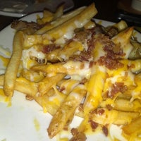Photo taken at Outback Steakhouse by Abe S. on 12/6/2012