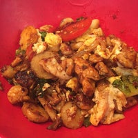 Photo taken at Genghis Grill by Terrence H. on 8/10/2015