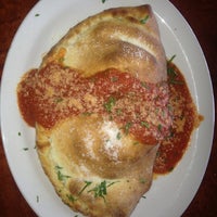 Photo taken at Crust Pizzeria and Ristorante by Jerry E. on 9/22/2012