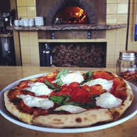 Photo taken at Olio Wood Fired Pizzeria by Kelly B. on 4/5/2013