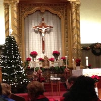 Photo taken at Our Lady of Angels Catholic Church by Angelica N. on 12/25/2012