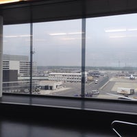 Photo taken at Gate G04 by Tizzie H. on 4/21/2014