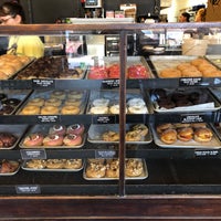 Photo taken at Revolution Doughnuts &amp;amp; Coffee by Chrys D. on 7/26/2019