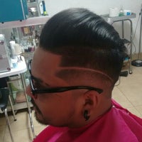 Photo taken at Alexis Barber Shop by Luis A. on 3/29/2016