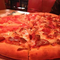 Photo taken at Bravo Pizza by Nikkyface G. on 10/28/2012