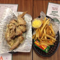 Photo taken at WING•STOP by Lisa P. on 3/20/2015