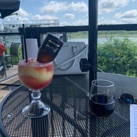 Photo taken at Kingfishers Waterfront Bar + Grill by Calvin A. on 7/10/2020