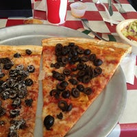 Photo taken at Carmine&amp;#39;s Pizzeria by Cathy L. on 12/21/2012