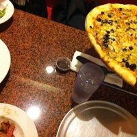 Photo taken at Brownstone Pizzeria by Liz V. on 12/19/2012