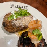 Photo taken at Firebirds Wood Fired Grill by Chris on 8/6/2022