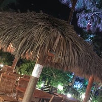 Photo taken at Bamboo Beach Tiki Bar &amp;amp; Cafe by nickie j. on 4/25/2018