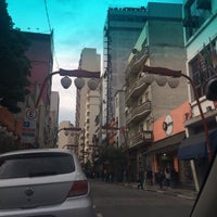 Photo taken at Rua Galvão Bueno by Carina O. on 4/15/2015