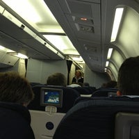 Photo taken at United Airlines Flight UA973 BRU-ORD by Baris H. on 12/17/2012