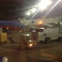Photo taken at Gate E12 by Ray O. on 12/22/2012