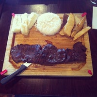 Photo taken at La Parrilla Colombian Steakhouse by Alex B. on 4/4/2013