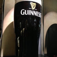 Photo taken at GUINNESS -THE PUB- 丸の内 (PAGLIACCIO 丸の内仲通り店) by T on 10/22/2012
