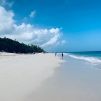 Photo taken at Elbow Beach by Anna G. on 8/6/2019
