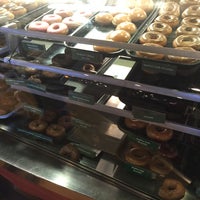 Photo taken at Krispy Kreme Doughnuts by Hiroshi M. on 12/25/2015