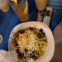 Photo taken at Ugly Dog Saloon and BBQ by Stephen C. on 2/3/2020