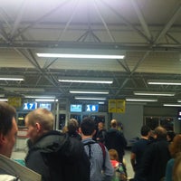 Photo taken at Gate A8 by Katerina P. on 2/12/2012
