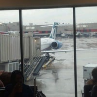 Photo taken at Gate D11 by Chris C. on 6/4/2012
