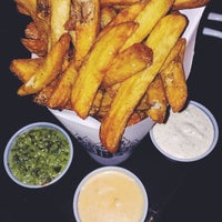 Photo taken at Pommes Frites by Brittany F. on 1/12/2015