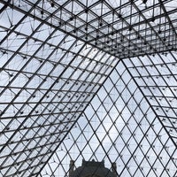 Photo taken at Louvre Pyramid by Richard Y. on 5/11/2018