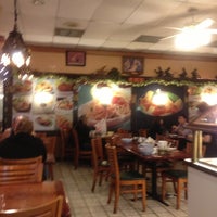 Photo taken at Ganda Restaurant by JoJo O. on 11/25/2012