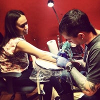 Photo taken at Lacute Tattoo by Αναστασία on 2/5/2014