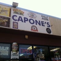 Photo taken at Capone&#39;s Liquor &amp; Food by Sebastian H. on 9/27/2013