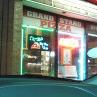 Photo taken at Grand Stand Pizza by Jen B. on 4/3/2013