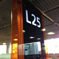Photo taken at Gate L25 by Dim Y. on 11/27/2012