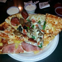 Photo taken at Rock Creek Pizza Co. by Dan R. on 12/24/2011
