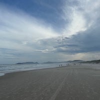 Photo taken at Praia da Joaquina by keith b. on 3/3/2024