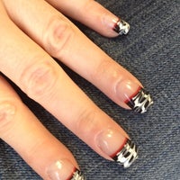 Photo taken at Cuticles Nail Salon by Cleo L. on 11/23/2012