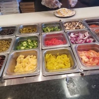 Photo taken at Top It Pizza by Amber M. on 6/9/2018
