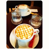 Photo taken at Masterpiece Café by Voraniya T. on 10/22/2012