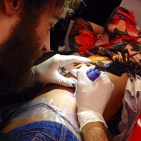 Photo taken at King 7 Tattoo by Inara I. on 10/8/2014