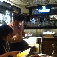 Photo taken at GUINNESS -THE PUB- 丸の内 (PAGLIACCIO 丸の内仲通り店) by Milliya T. on 10/14/2012