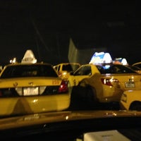 Photo taken at Taxi Holding Lot by John A. on 12/18/2012