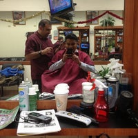 Photo taken at Benny&amp;#39;s Barbershop by Napoleon S. on 12/14/2012