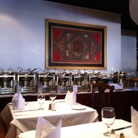 Photo taken at Saffron Indian Cuisine by Mark C. on 12/15/2012