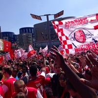 Photo taken at Arsenal Victory Parade by Becky W. on 5/18/2014
