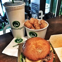 Photo taken at Wahlburgers by Tom D. on 2/23/2015