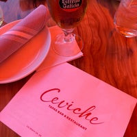 Photo taken at Ceviche Tapas Bar and Restaurant by Tommy on 3/28/2022