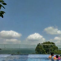 Photo taken at 8th Floor Rooftop Swimming Pool @ Changi Village Hotel by Mattew T. on 1/27/2013